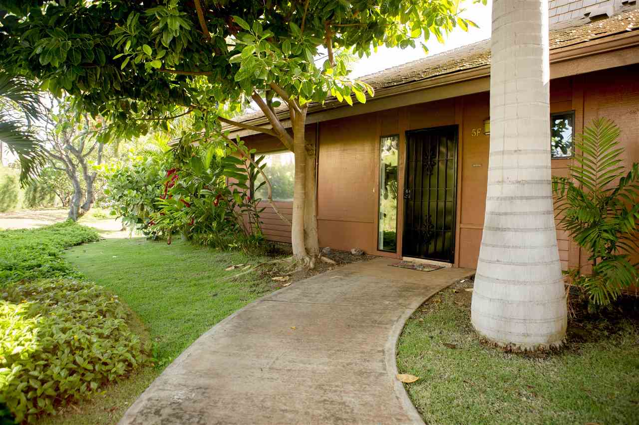 811 South Kihei Road, Unit 5F Kihei, HI 96753 - Photo 14 of 30 a front view of a house with a yard