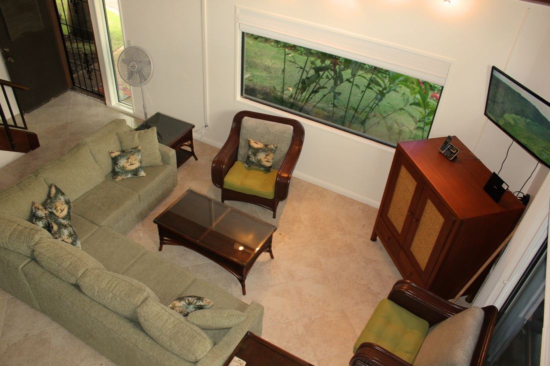 811 South Kihei Road, Unit 5F Kihei, HI 96753 - Photo 2 of 30 a living room with furniture and a flat screen tv