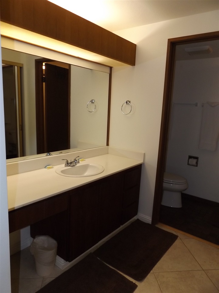 811 South Kihei Road, Unit 5F Kihei, HI 96753 - Photo 21 of 30 a bathroom with a sink and a mirror