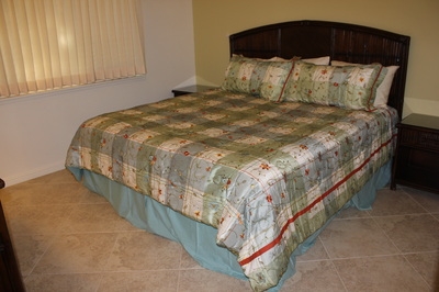 811 South Kihei Road, Unit 5F Kihei, HI 96753 - Photo 22 of 30 a bed sitting in a bedroom next to a window