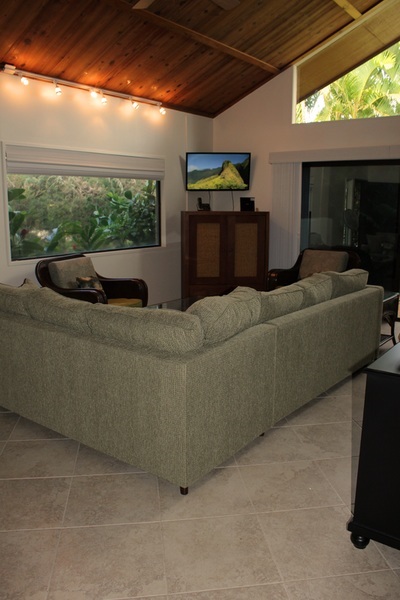 811 South Kihei Road, Unit 5F Kihei, HI 96753 - Photo 26 of 30 a living room with couches and a flat screen tv