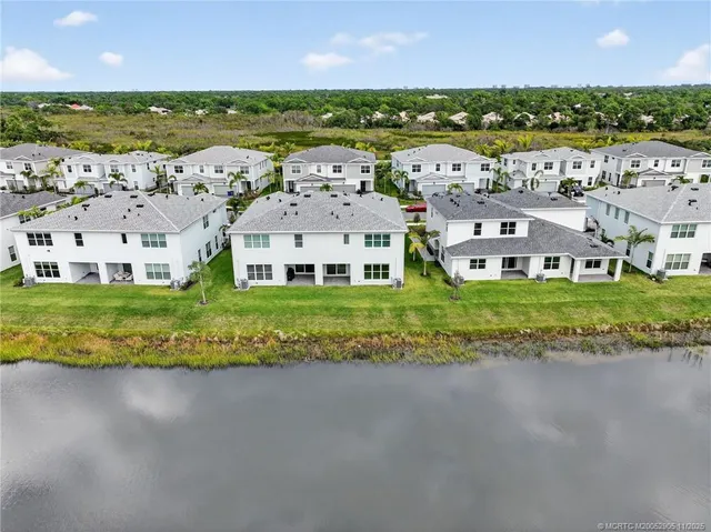 an aerial view of a house with a garden and plants