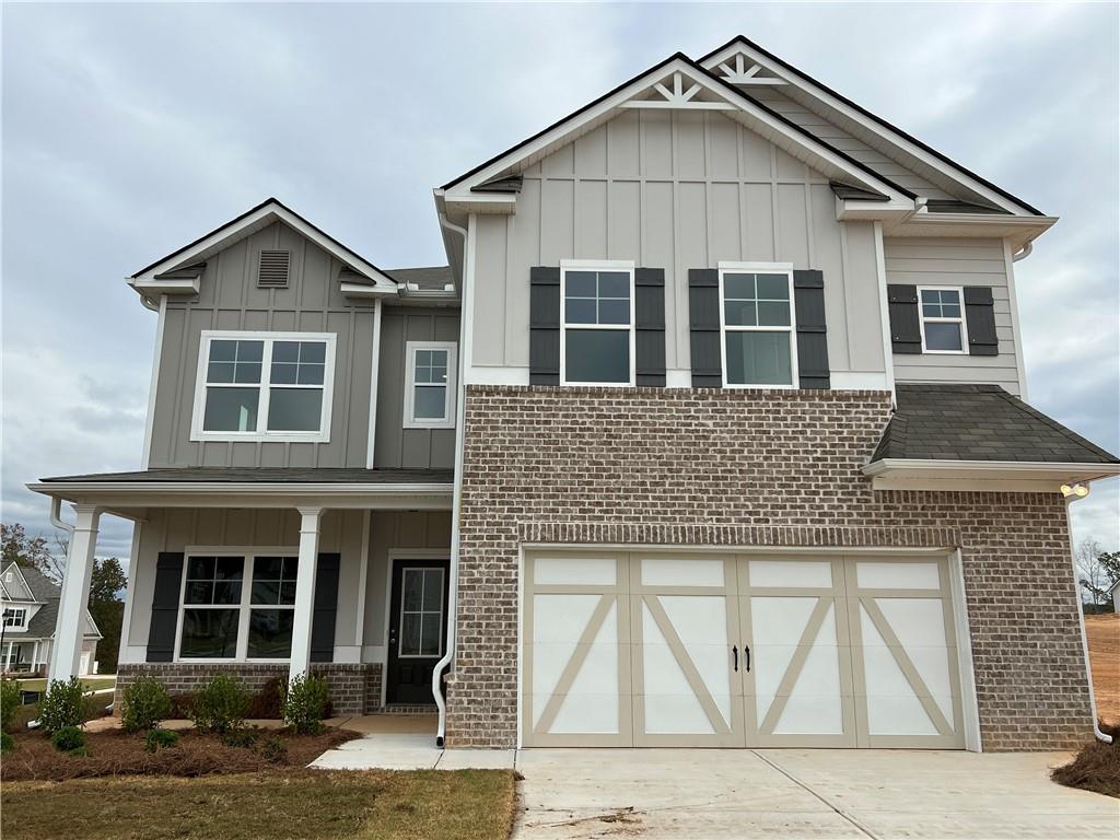 a front view of a house with garage
