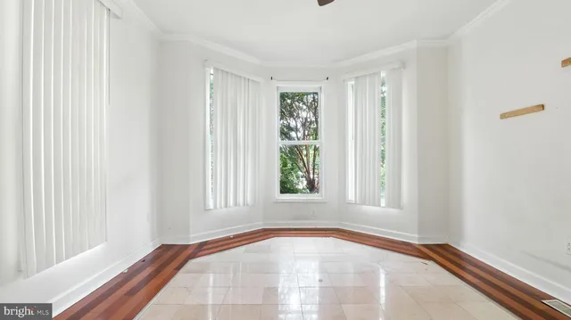 a view of an empty room and window