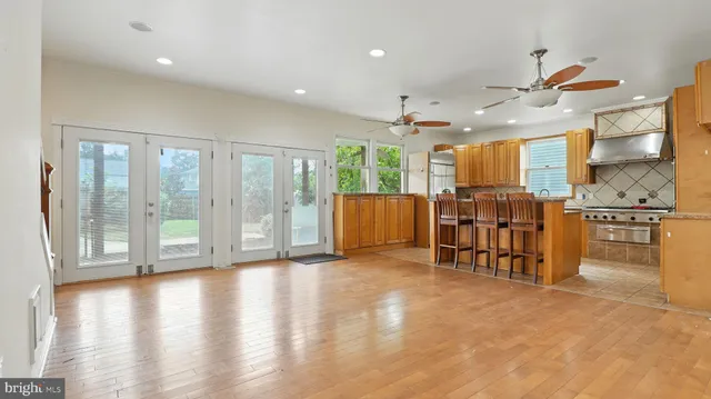 a view of a kitchen with large windows