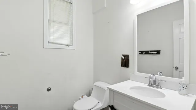 front view of a brick house with a small yard