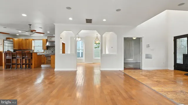 a view of a kitchen with cabinets and wooden floor