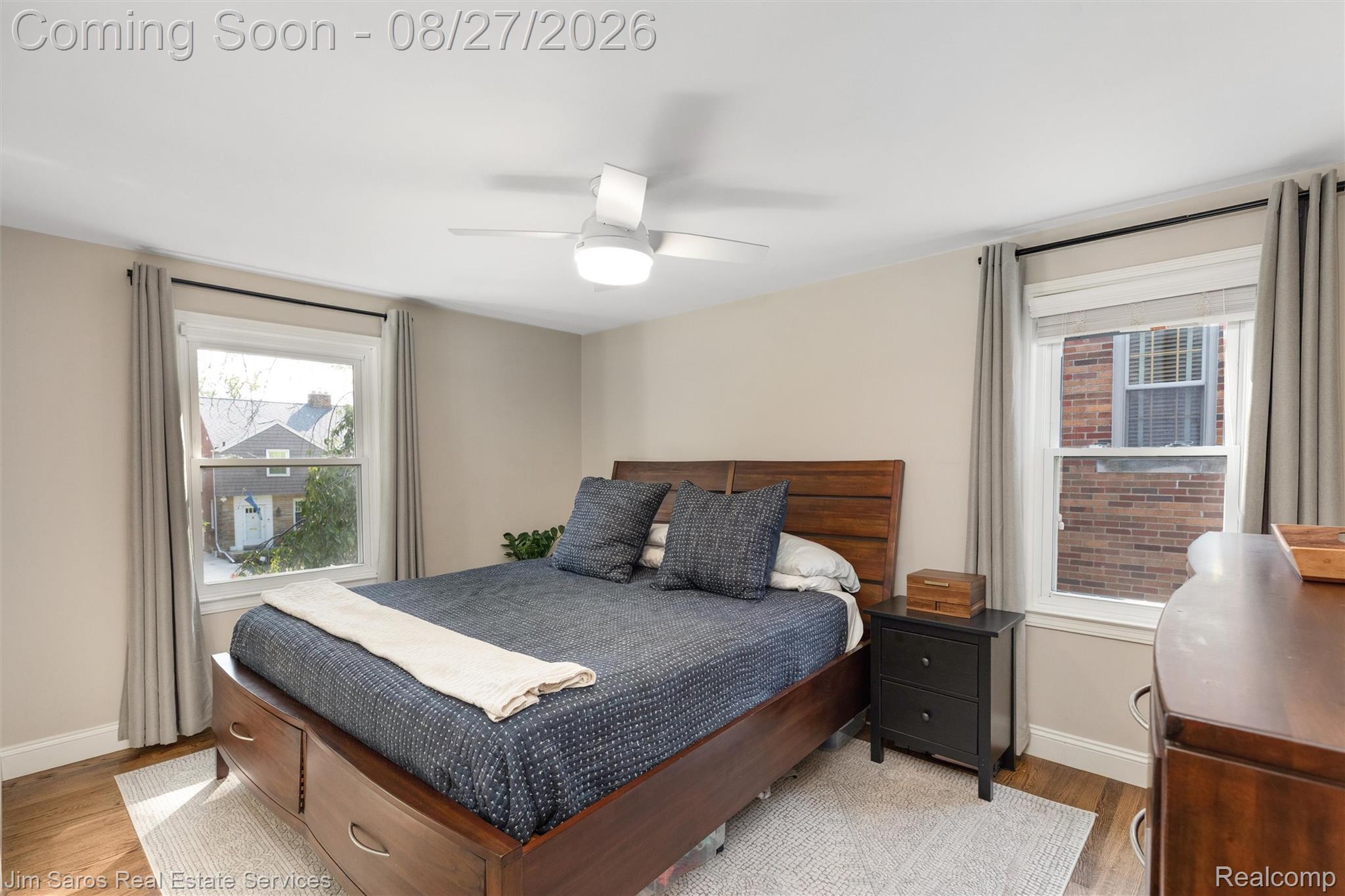 276 Moran Road Grosse Pointe, MI 48236 - Photo 12 of 23 Hardwood flooring, painted walls, white trim, and a ceiling fan with integrated lighting