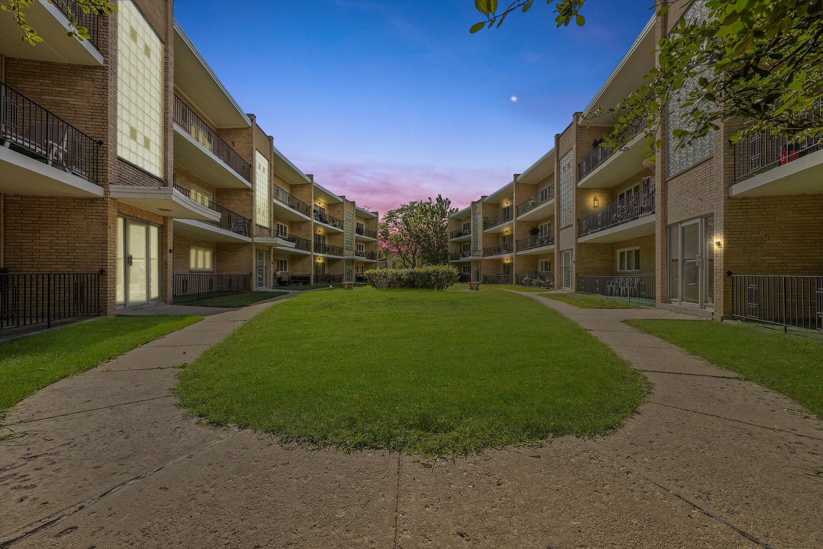 10340 South Pulaski Road, Unit 103 Oak Lawn, IL 60453 - Photo 1 of 30 a view of a building with a yard