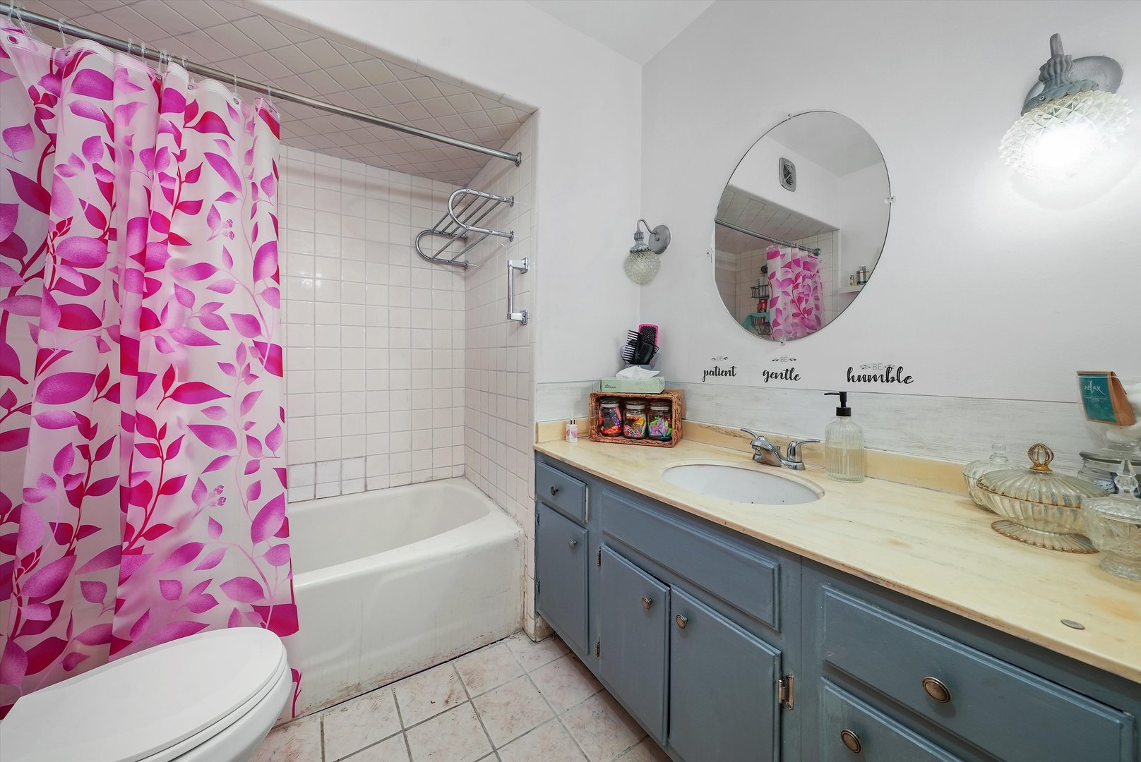 10340 South Pulaski Road, Unit 103 Oak Lawn, IL 60453 - Photo 11 of 30 a bathroom with a bath tub sink mirror vanity and toilet