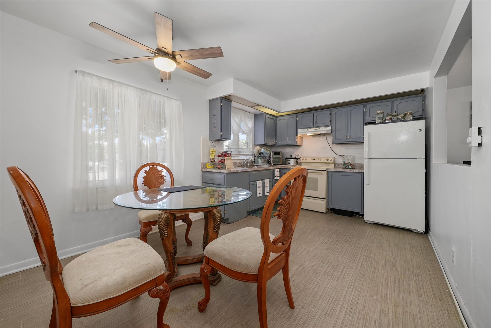 10340 South Pulaski Road, Unit 103 Oak Lawn, IL 60453 - Photo 13 of 30 a view of a dining room with furniture and a chandelier