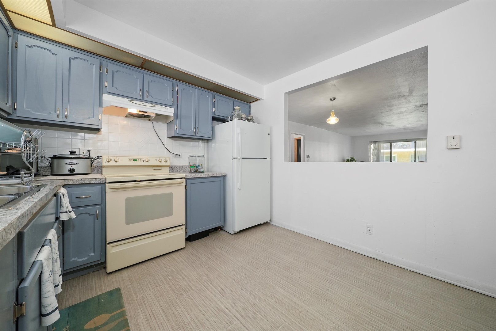 10340 South Pulaski Road, Unit 103 Oak Lawn, IL 60453 - Photo 17 of 30 a view of a kitchen with sink and cabinets
