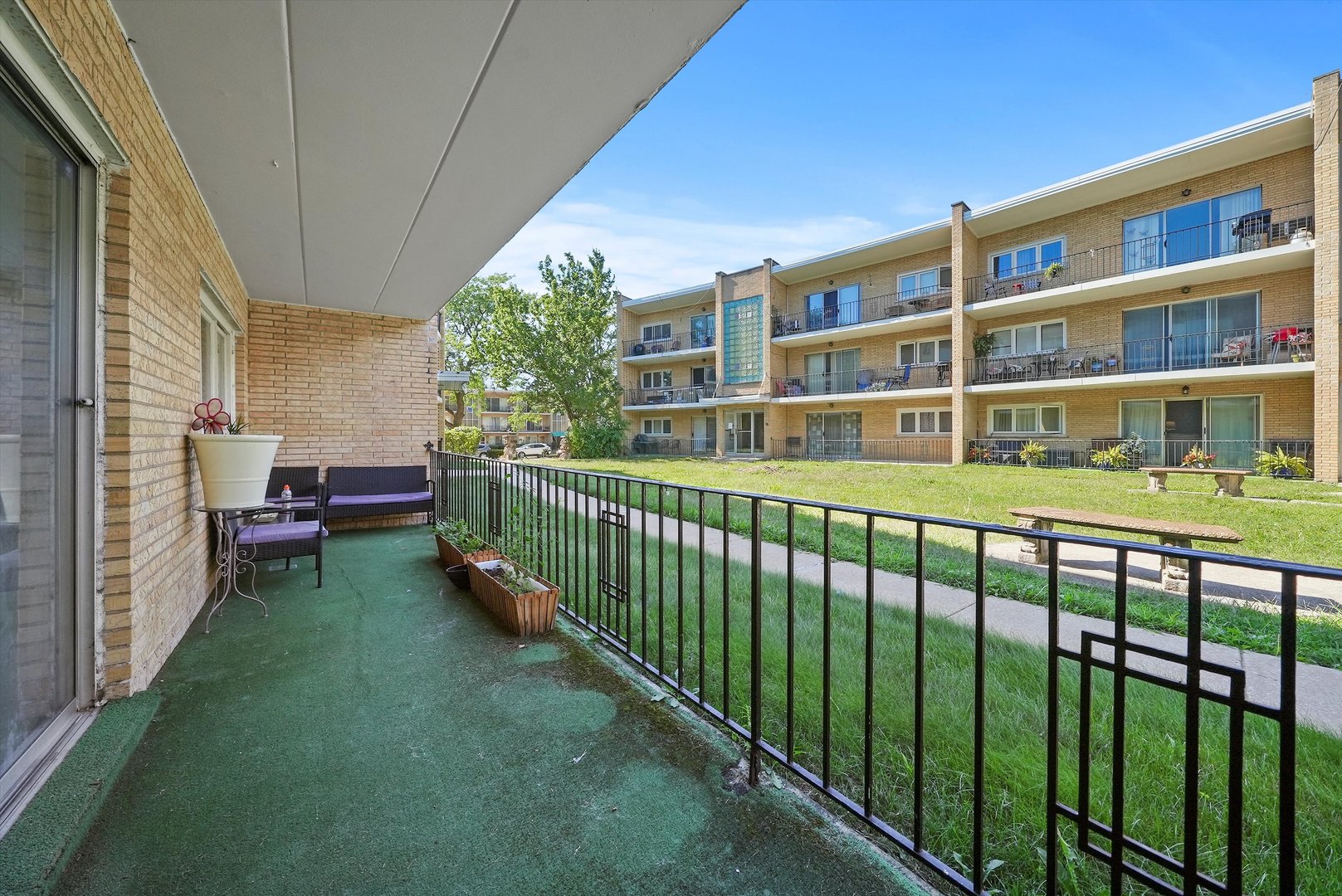 10340 South Pulaski Road, Unit 103 Oak Lawn, IL 60453 - Photo 19 of 30 a front view of a house with a yard