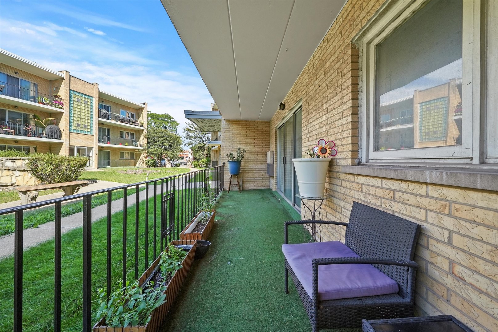 10340 South Pulaski Road, Unit 103 Oak Lawn, IL 60453 - Photo 20 of 30 a view of two chairs in the balcony