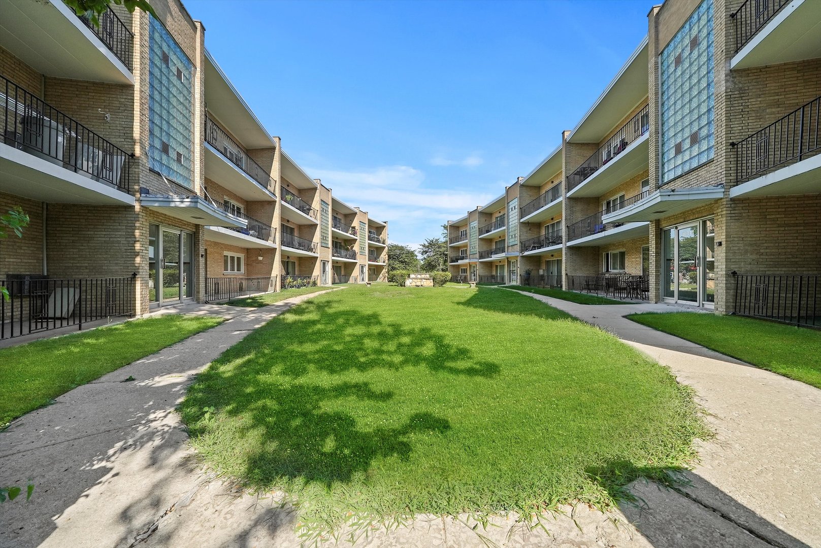 10340 South Pulaski Road, Unit 103 Oak Lawn, IL 60453 - Photo 21 of 30 a front view of a building with a garden