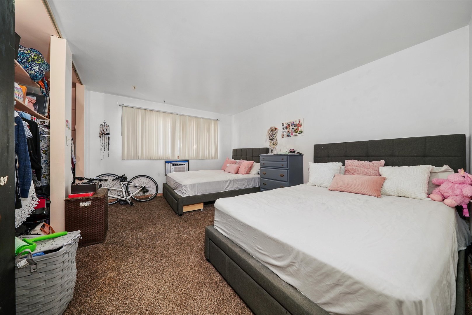 10340 South Pulaski Road, Unit 103 Oak Lawn, IL 60453 - Photo 7 of 30 a bedroom with two beds and a potted plant