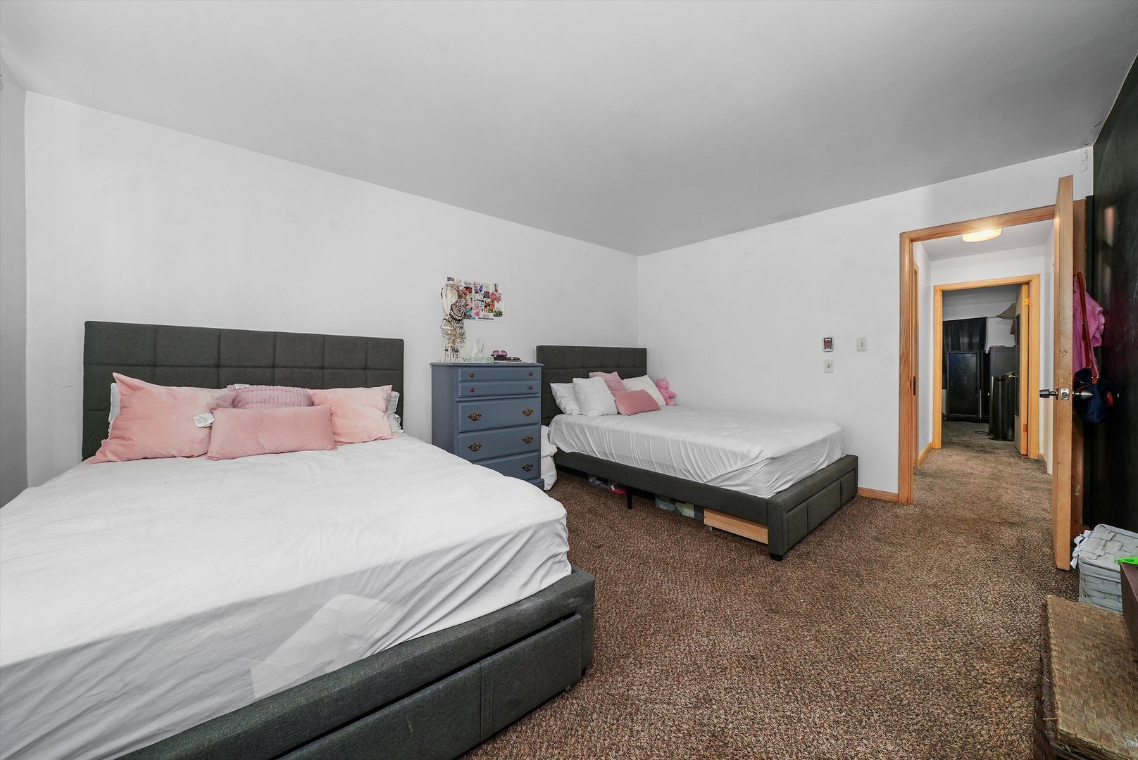 10340 South Pulaski Road, Unit 103 Oak Lawn, IL 60453 - Photo 8 of 30 a bedroom with a bed and a night stand