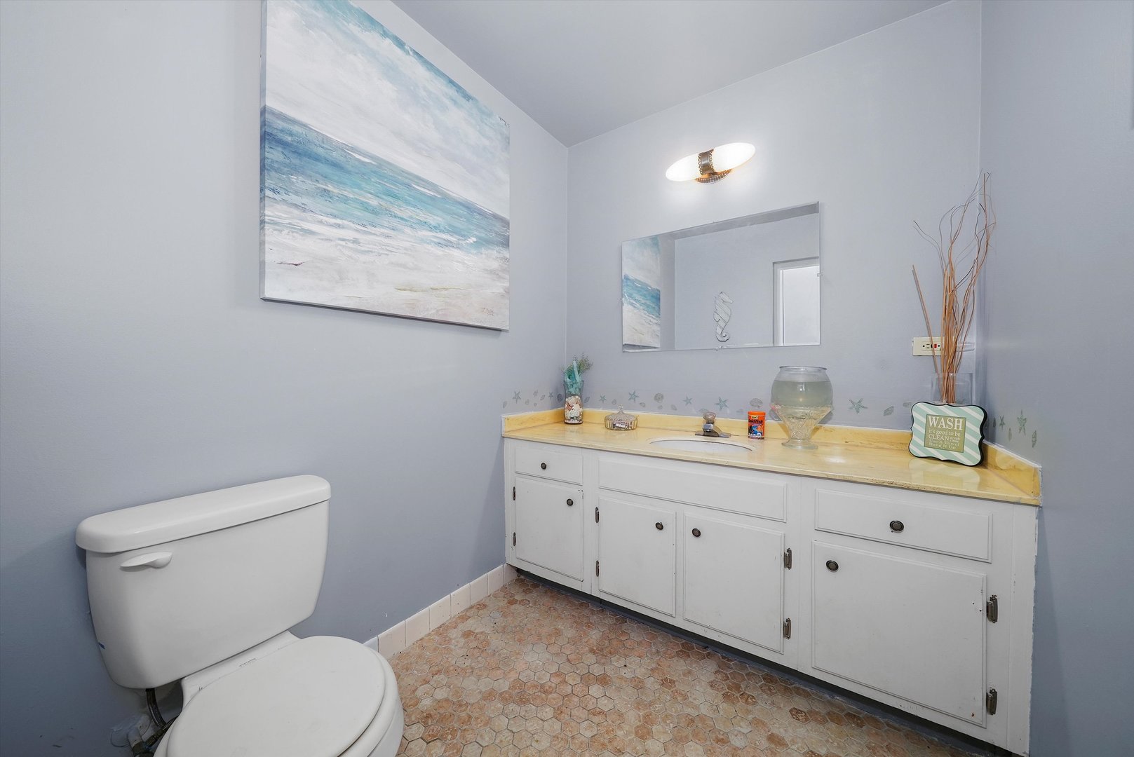 10340 South Pulaski Road, Unit 103 Oak Lawn, IL 60453 - Photo 9 of 30 a bathroom with a toilet sink and mirror