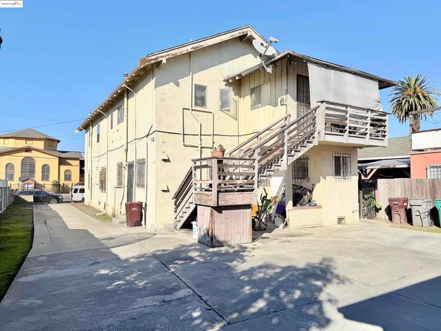 a view of a white building among the street