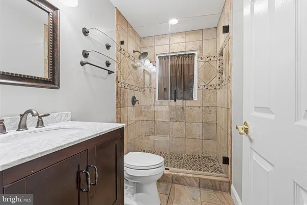 a view of a livingroom with a ceiling fan and window