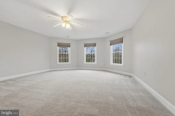 a spacious bathroom with a double vanity sink a mirror and a bathtub