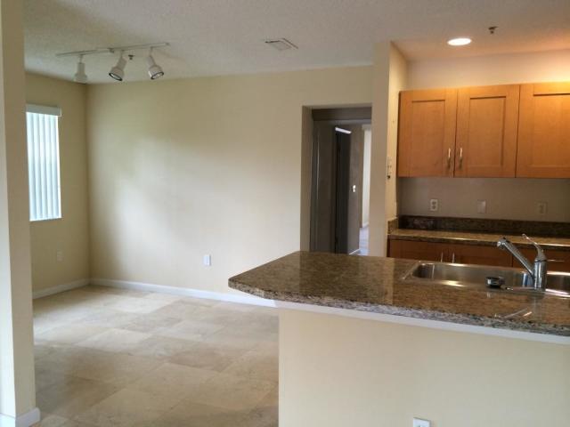 3279 Clint Moore Road, Unit 201 Boca Raton, FL 33496 - Photo 12 of 27 a bathroom with a granite countertop sink and mirror