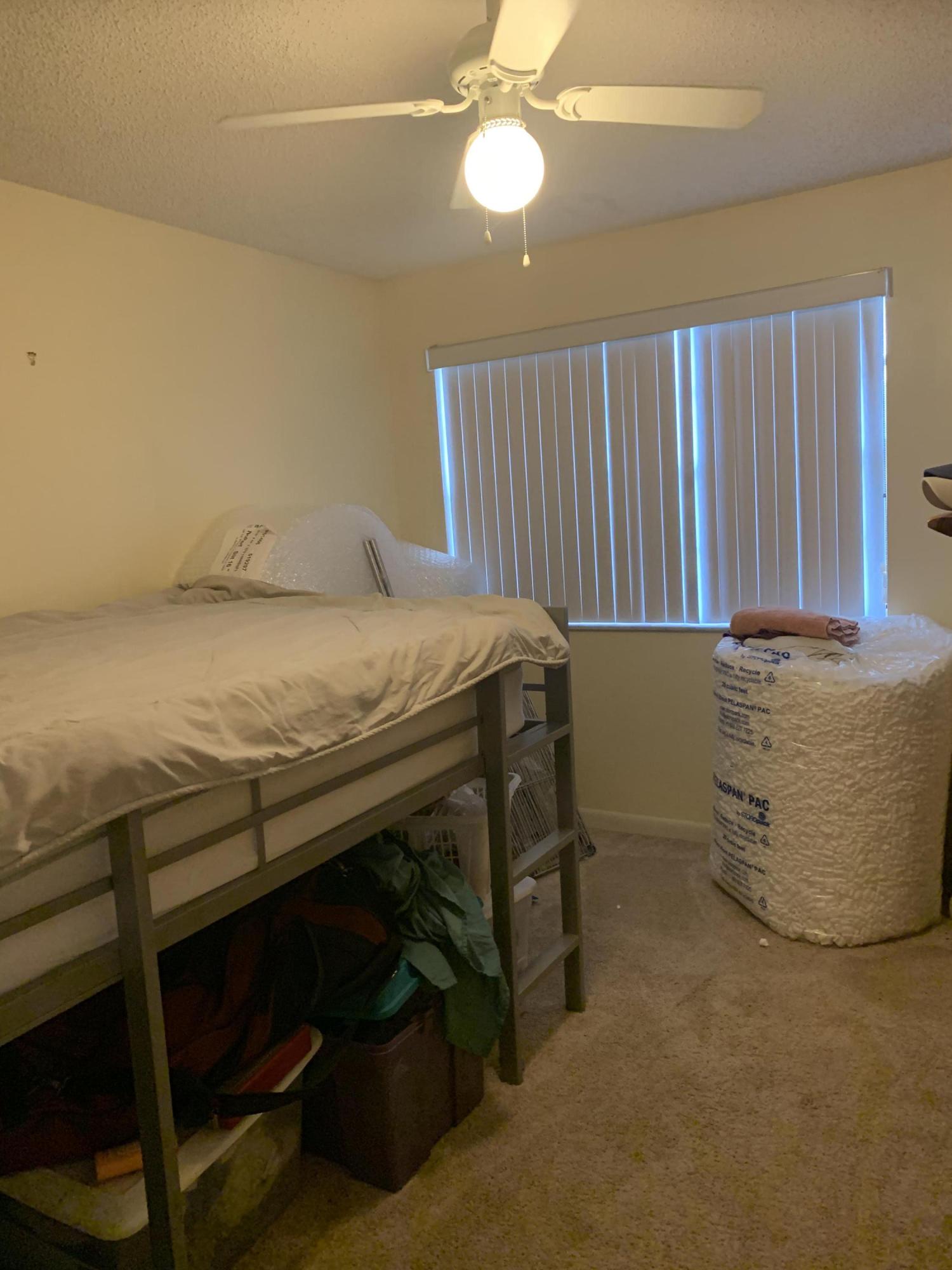 3279 Clint Moore Road, Unit 201 Boca Raton, FL 33496 - Photo 19 of 27 a room with table and chair