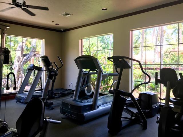 3279 Clint Moore Road, Unit 201 Boca Raton, FL 33496 - Photo 22 of 27 a view of a room with gym equipment