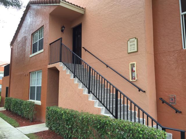 3279 Clint Moore Road, Unit 201 Boca Raton, FL 33496 - Photo 3 of 27 a view of a house with wooden stairs