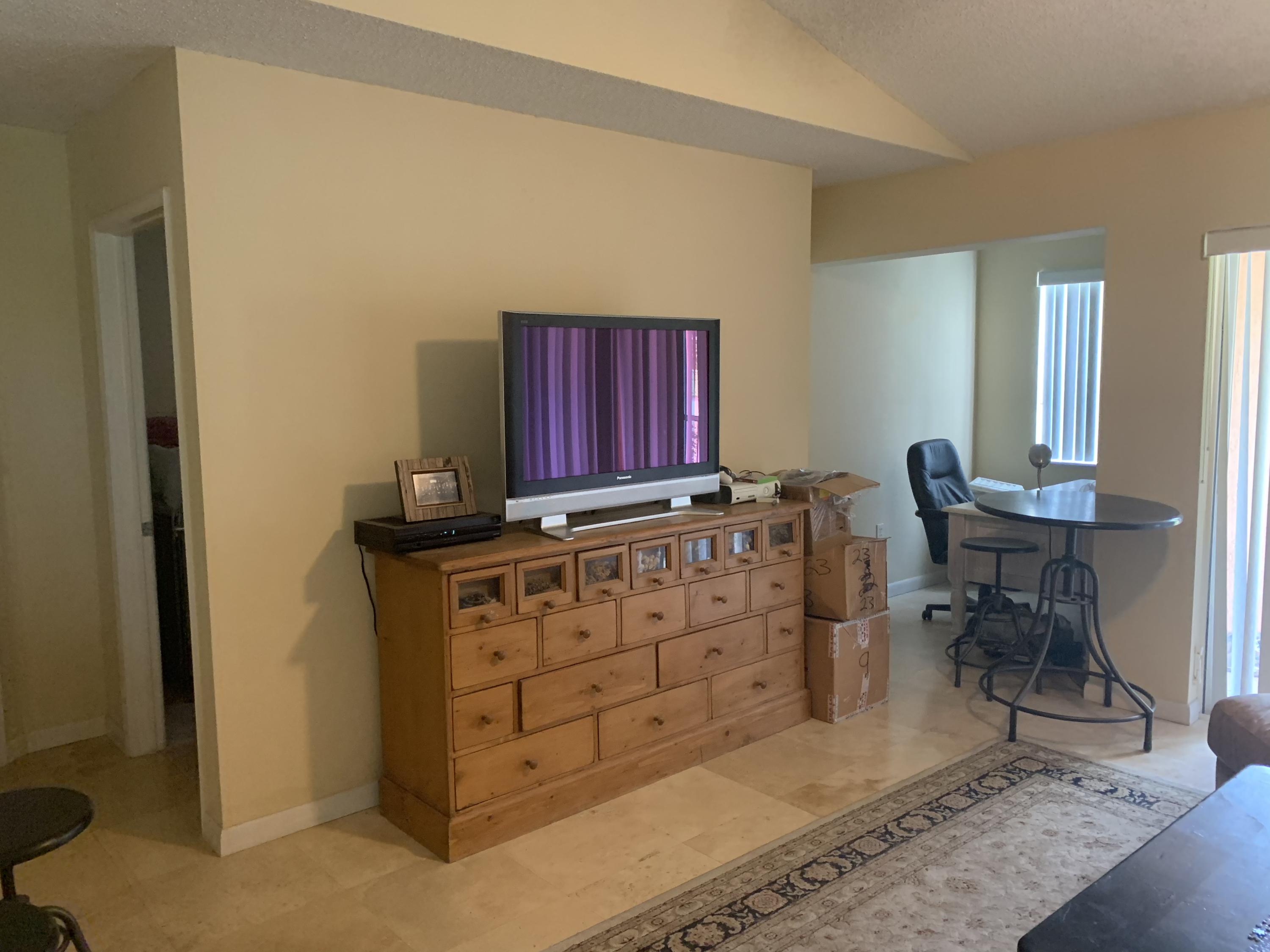 3279 Clint Moore Road, Unit 201 Boca Raton, FL 33496 - Photo 6 of 27 a view of a workspace with furniture