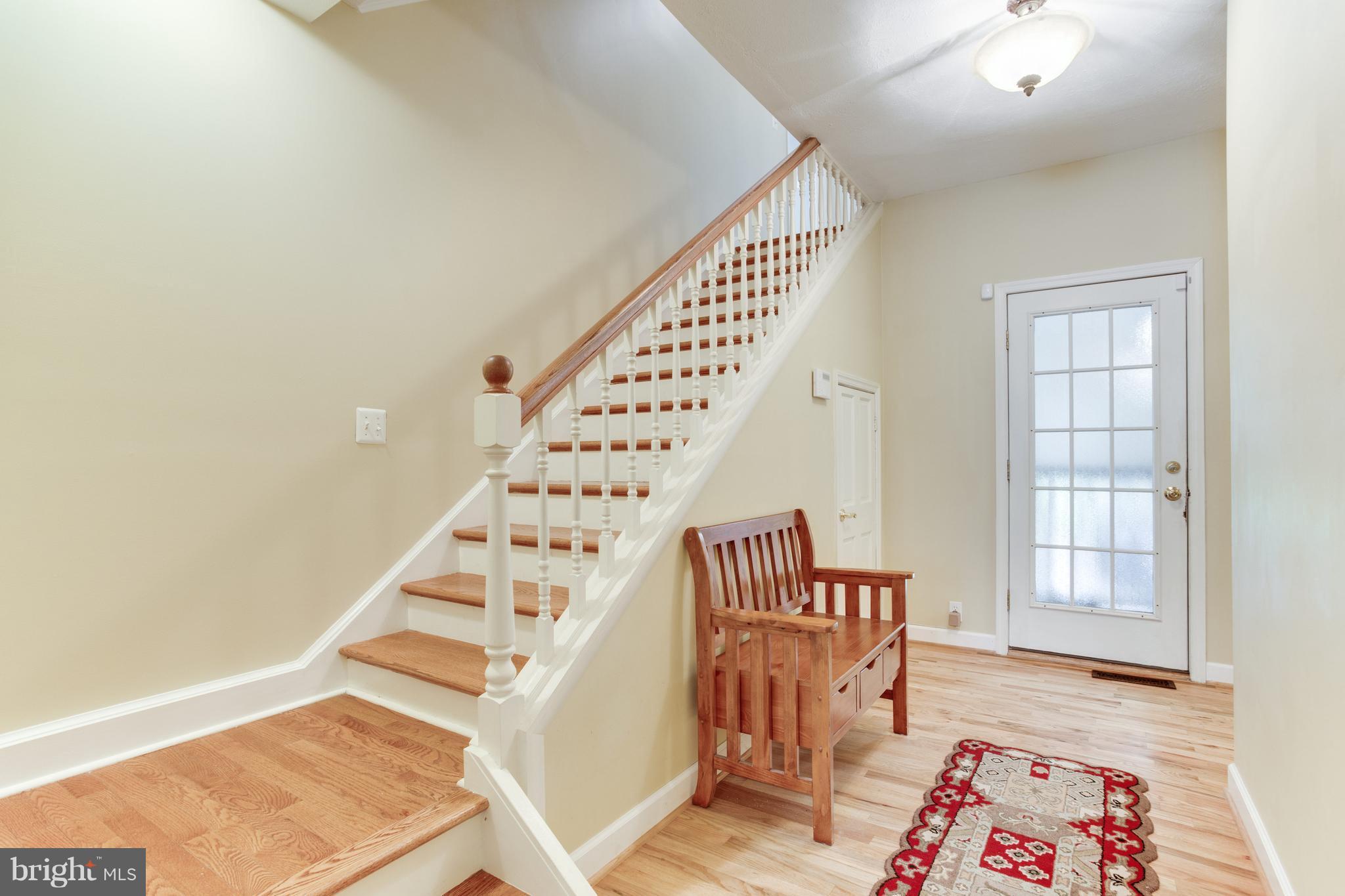 722 Dividing Road Severna Park, MD 21146 - Photo 22 of 30 Hardwood Staircase & Garage Entrance