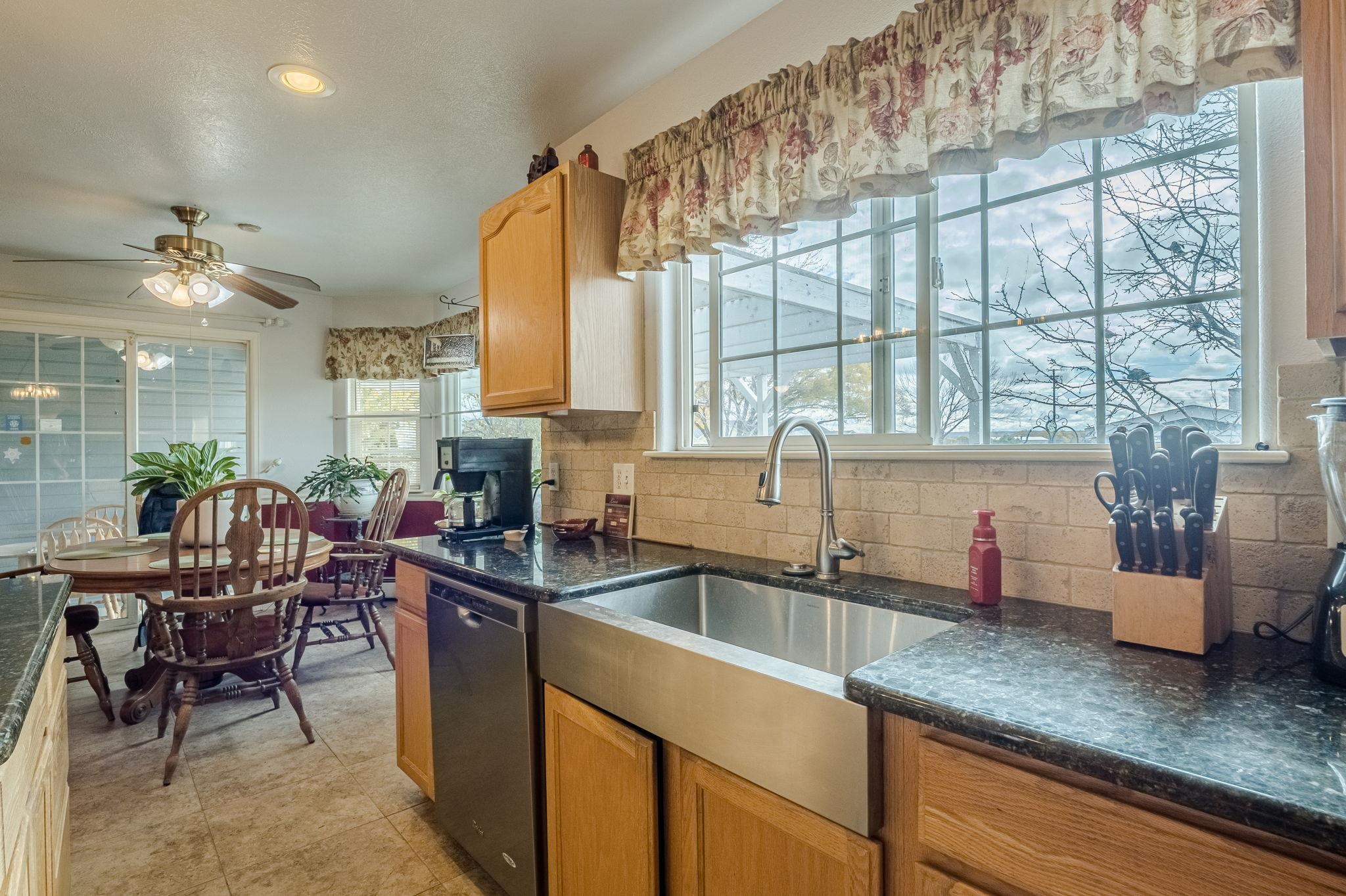 3153 Forrest Way Grand Junction, CO 81504 - Photo 12 of 42 a kitchen with a sink and a large window