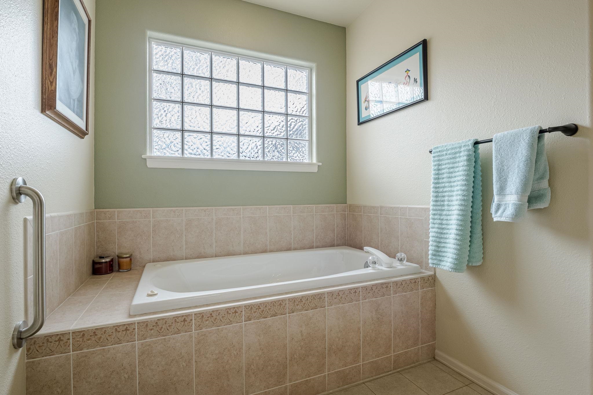 3153 Forrest Way Grand Junction, CO 81504 - Photo 20 of 42 a bath tub sitting next to a window
