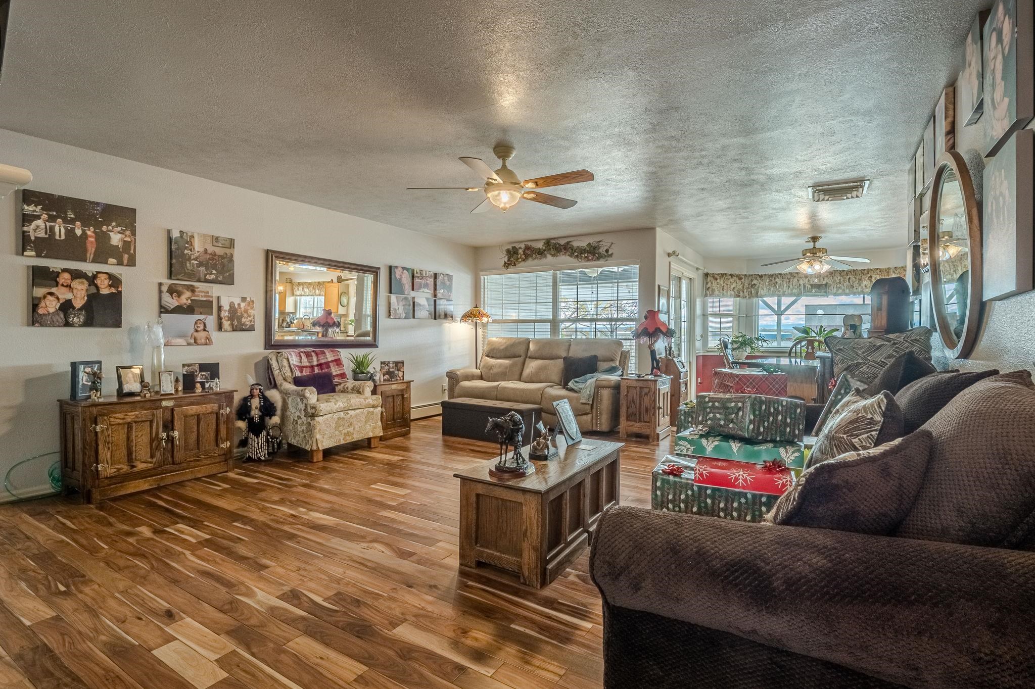 3153 Forrest Way Grand Junction, CO 81504 - Photo 2 of 42 a living room with furniture and a flat screen tv