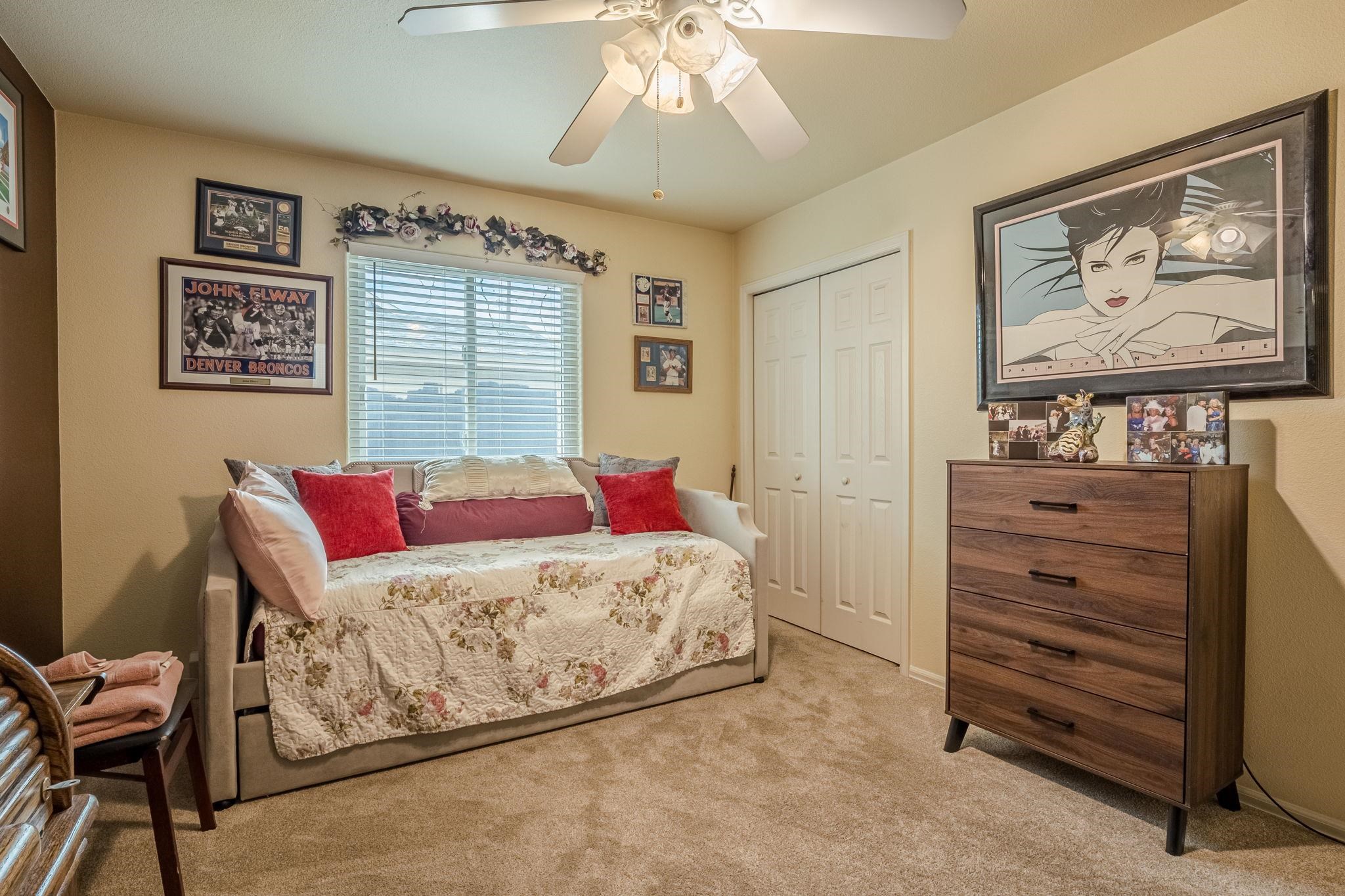 3153 Forrest Way Grand Junction, CO 81504 - Photo 26 of 42 a bedroom with a bed and furniture