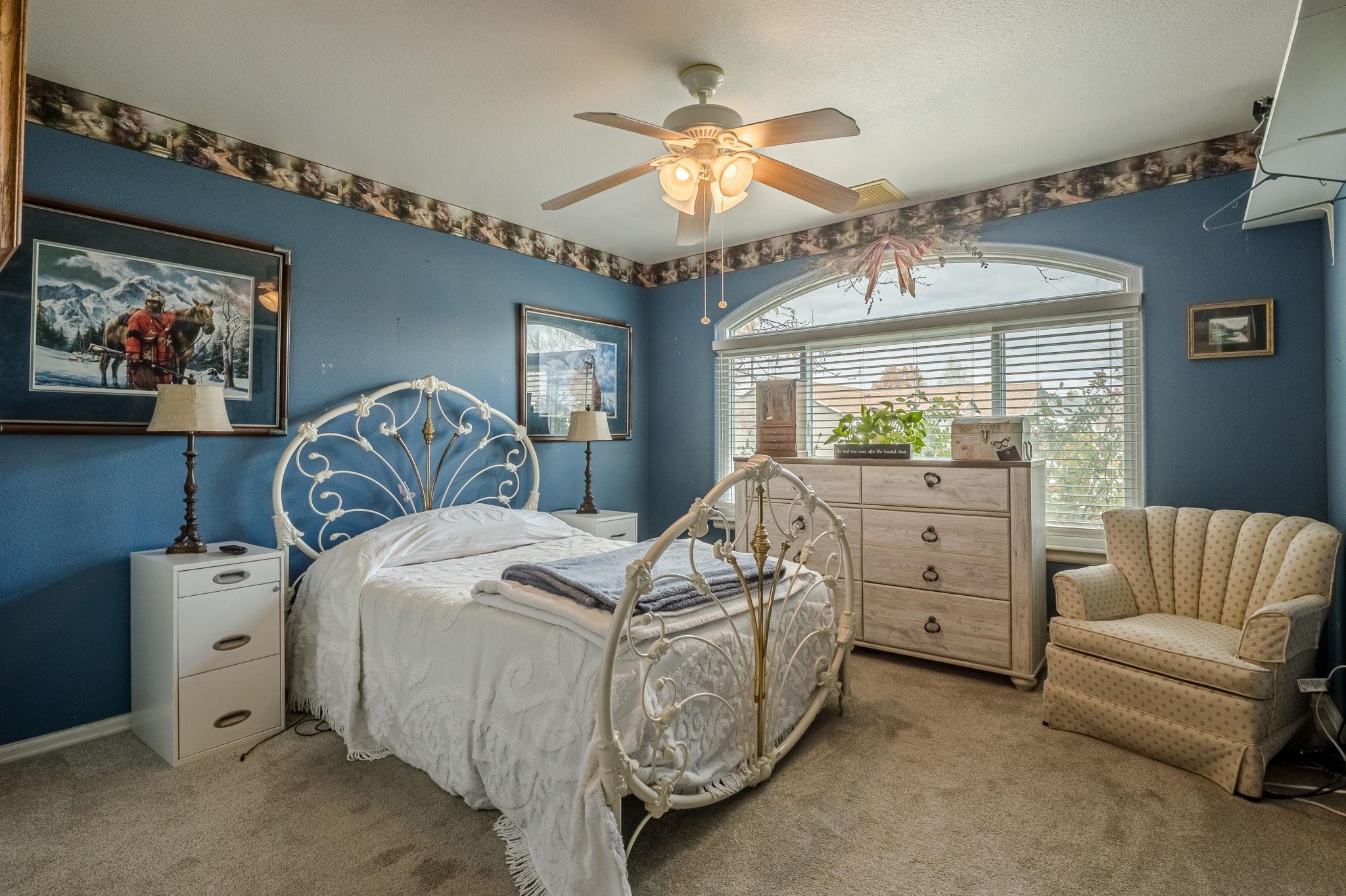 3153 Forrest Way Grand Junction, CO 81504 - Photo 29 of 42 a bed room with a bed and a couch