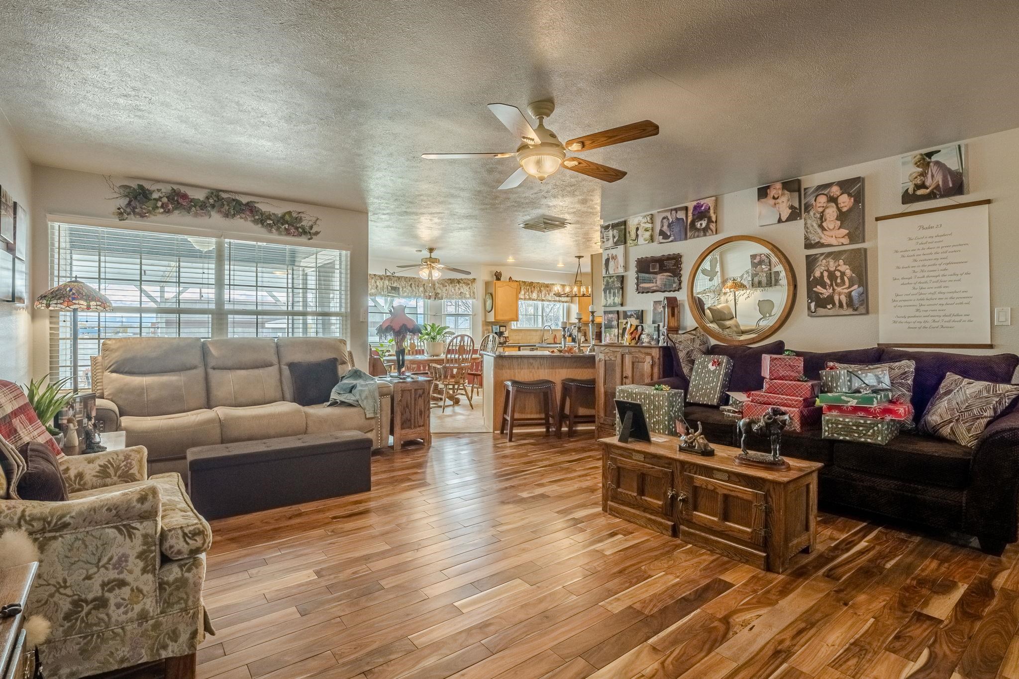 3153 Forrest Way Grand Junction, CO 81504 - Photo 3 of 42 a living room with fireplace furniture and a large window