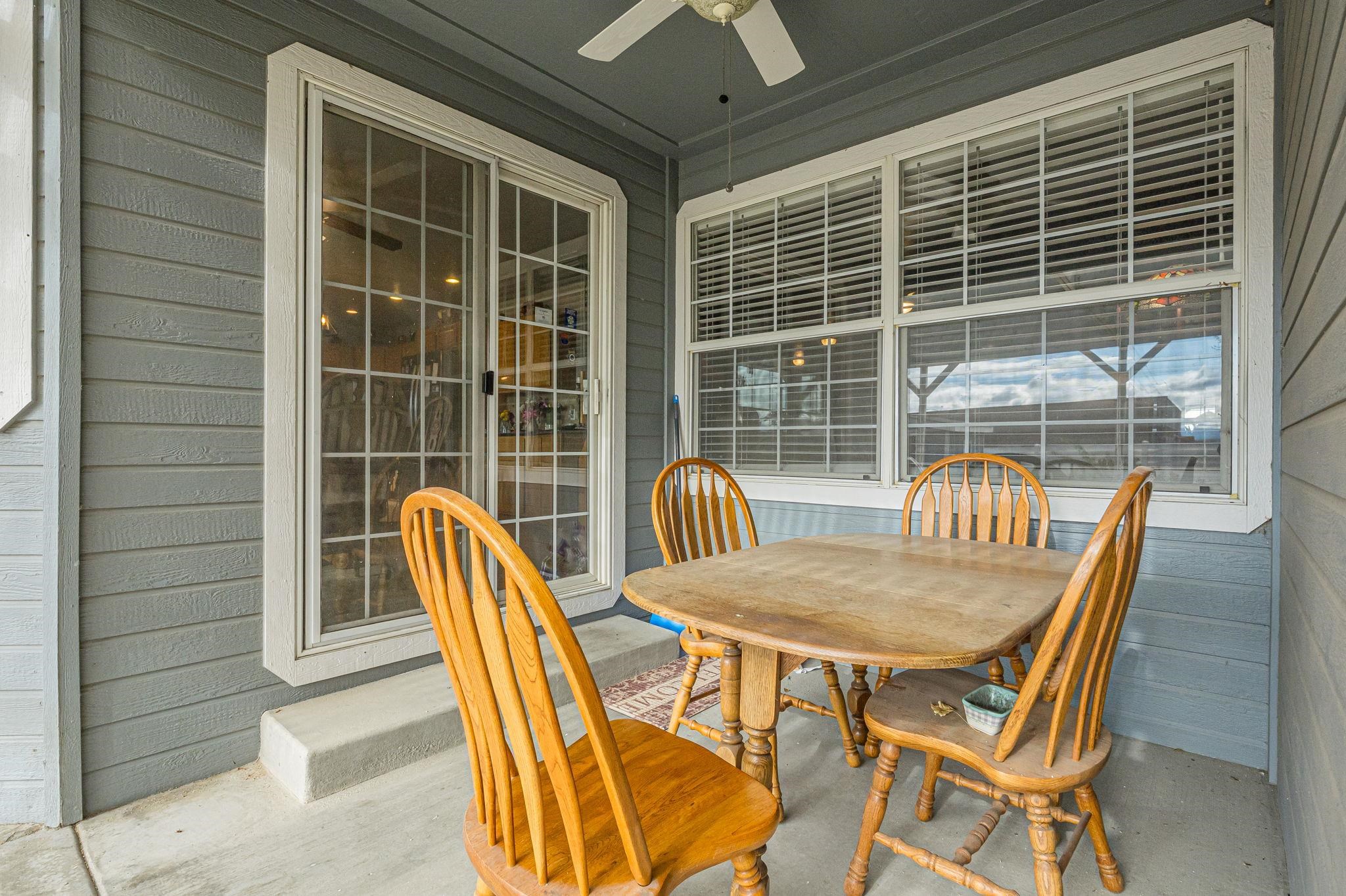 3153 Forrest Way Grand Junction, CO 81504 - Photo 31 of 42 a view of a dining room with furniture and wooden floor