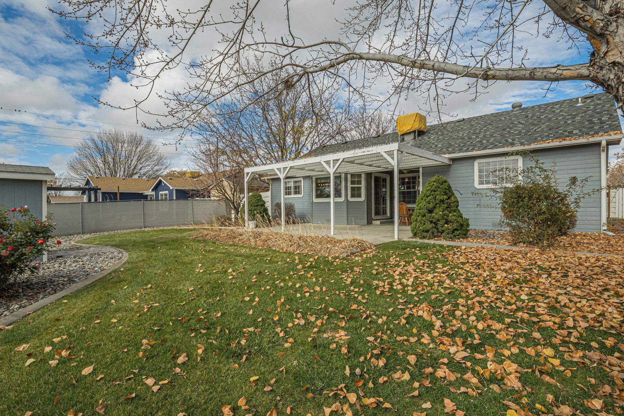 3153 Forrest Way Grand Junction, CO 81504 - Photo 39 of 42 front view of a house with a garden