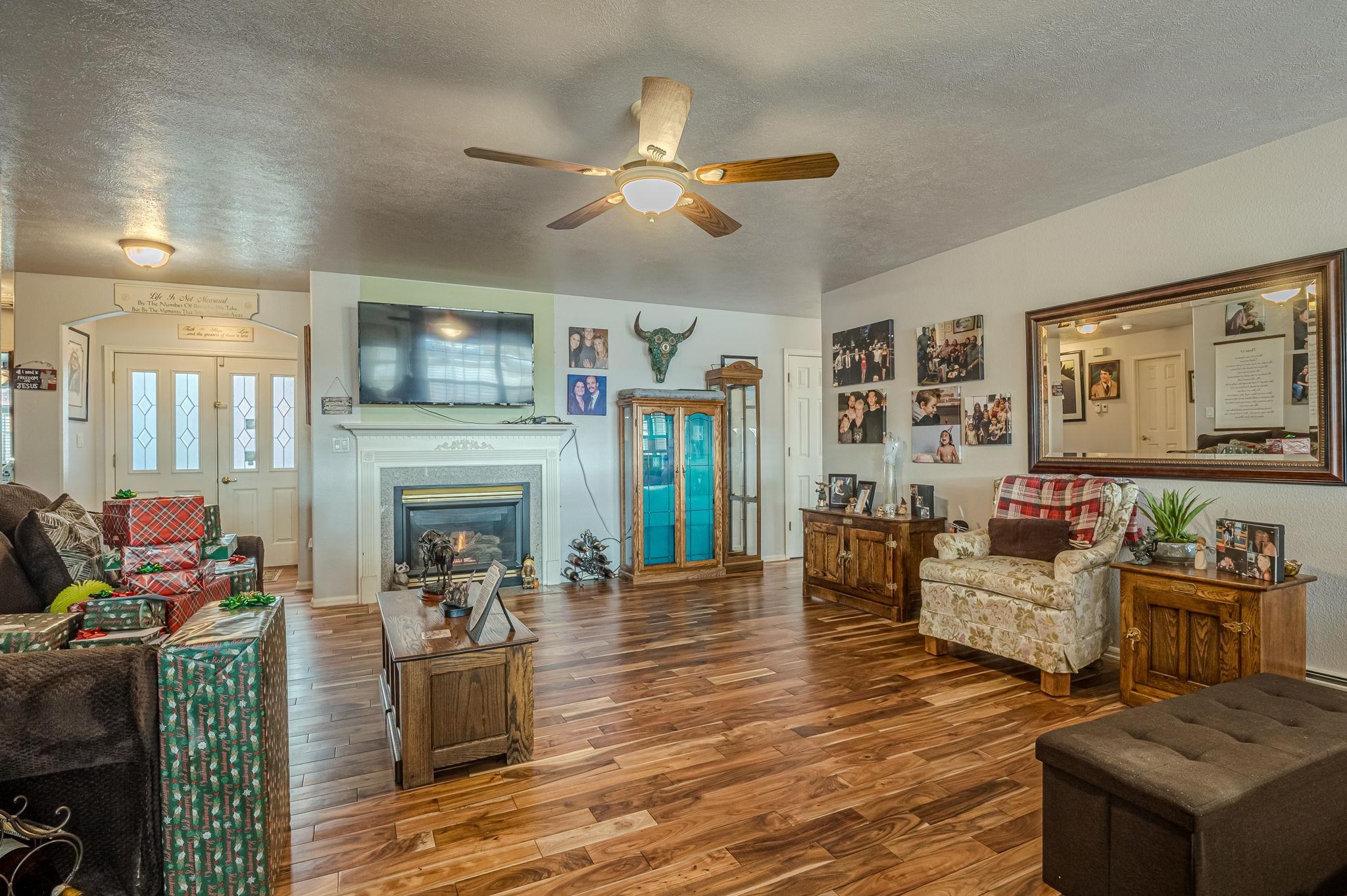 3153 Forrest Way Grand Junction, CO 81504 - Photo 5 of 42 a living room with furniture and a fireplace