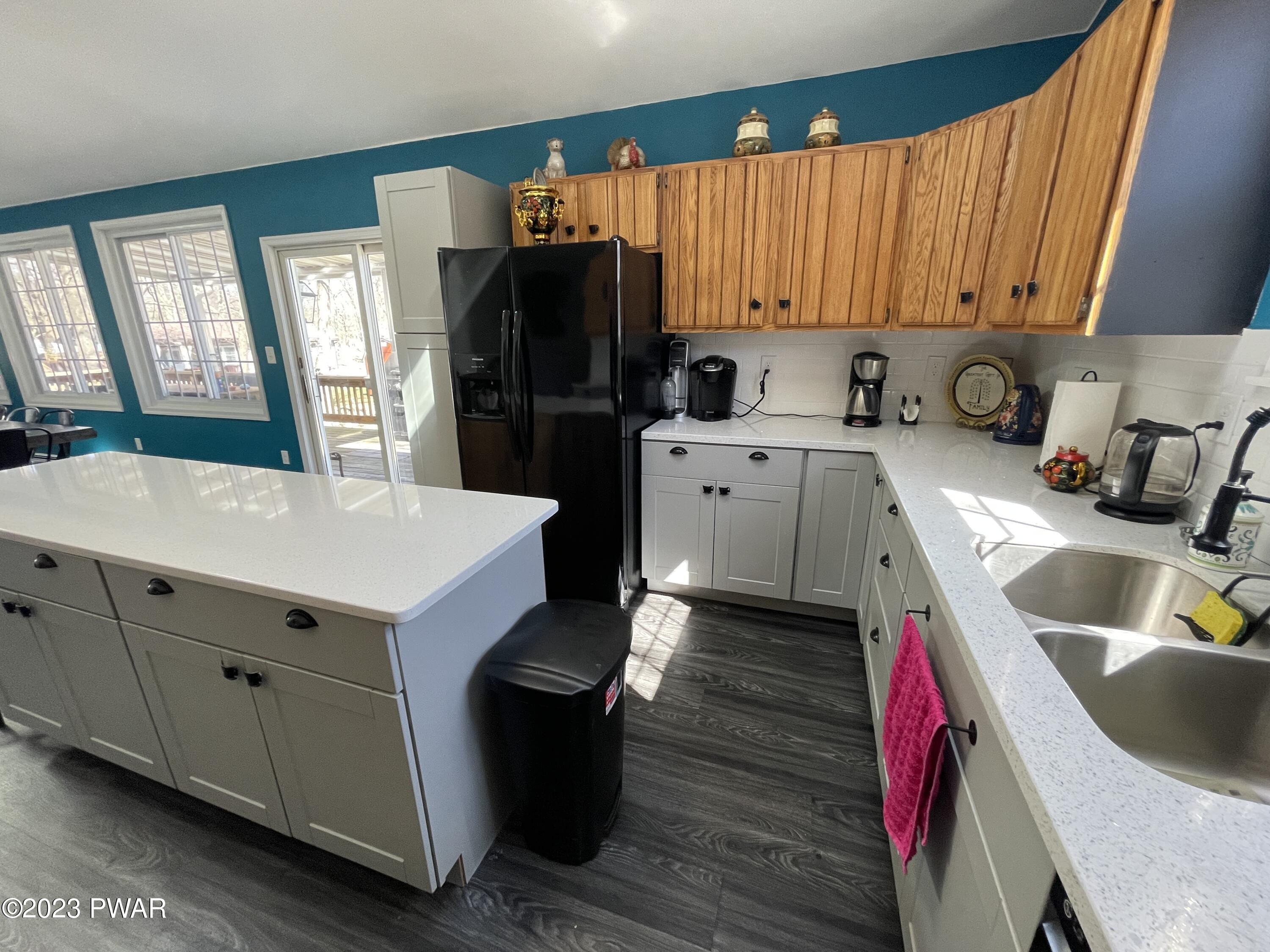 146 Roundhill Road Dingmans Ferry, PA 18328 - Photo 16 of 53 a kitchen with a sink and cabinets