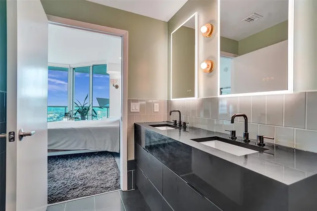 a bathroom with a sink and a mirror