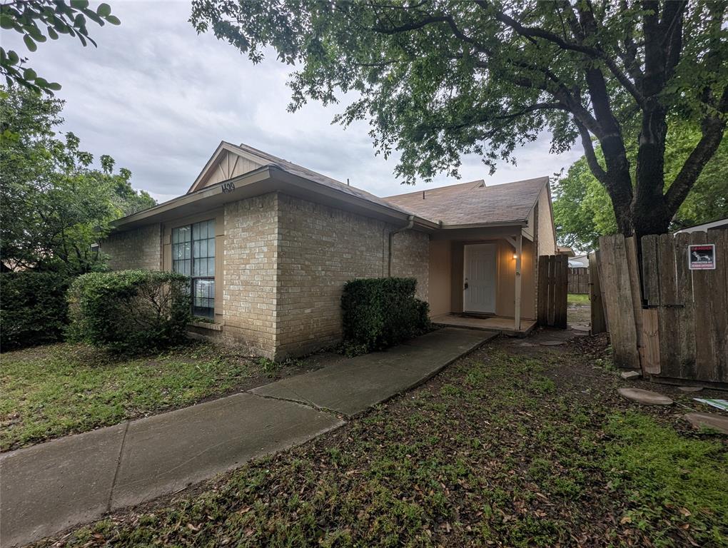 4629 Chapman Street The Colony, TX 75056 - Photo 1 of 1 a front view of a house with garden