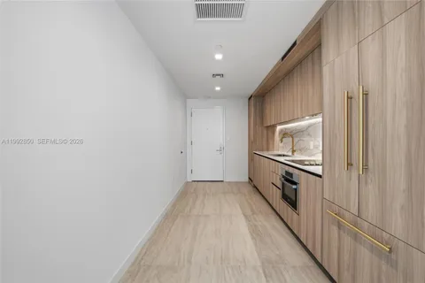 a view of an empty room with a entryway