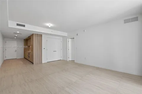 a bathroom with a double vanity sink toilet and a mirror