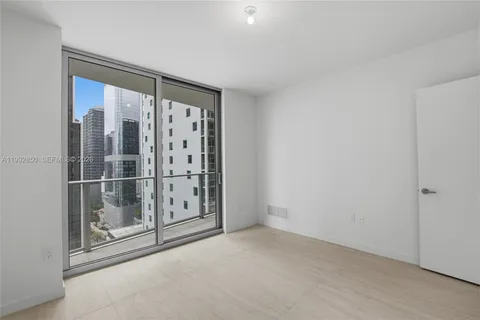 a view of a balcony with a floor to ceiling window