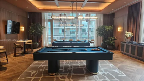 a blue bed sitting in a bedroom next to a window