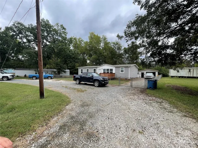 a house view with a play ground in front of it