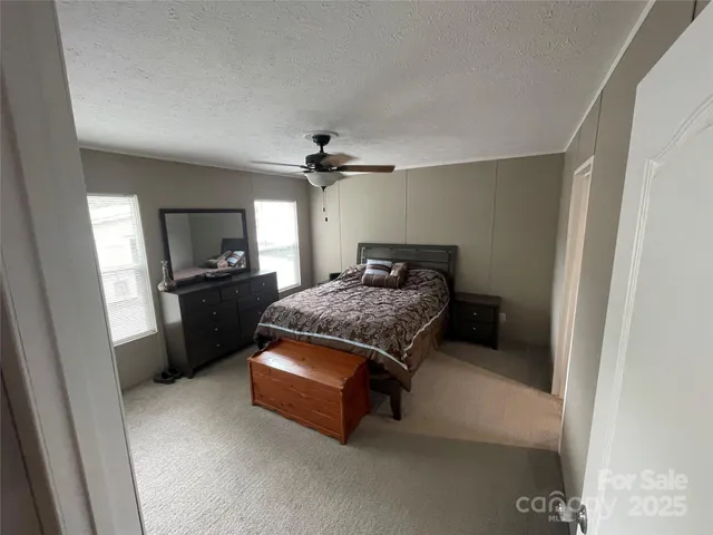 a bedroom with a bed and a sink