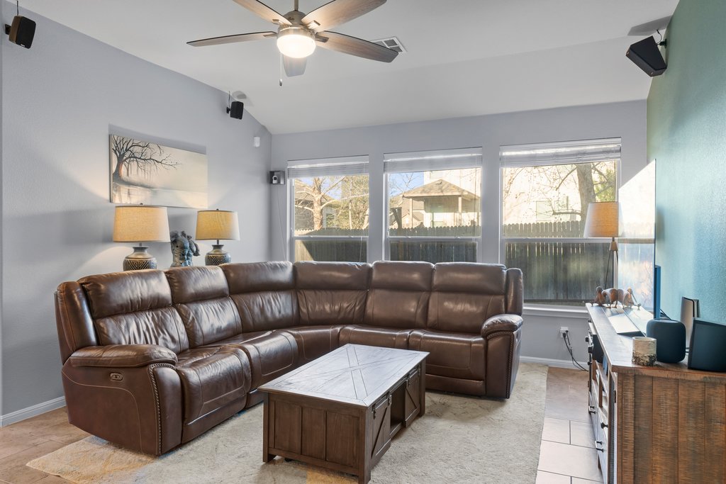 2902 Tempe Drive Cedar Park, TX 78641 - Photo 13 of 38 Living room with lofted ceiling and a ceiling fan